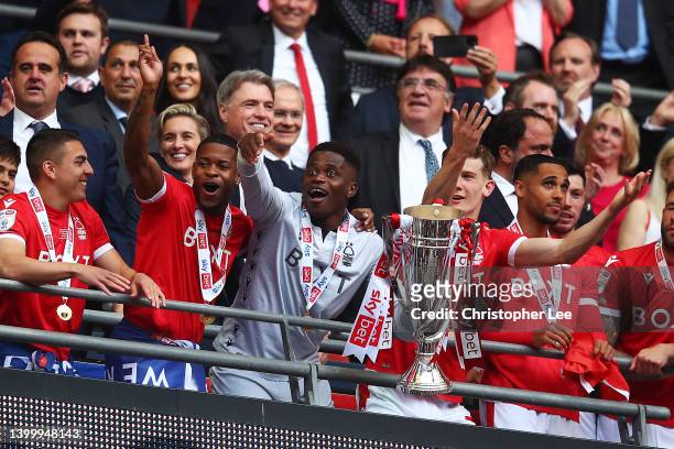 Brice Samba of Nottingham Forest lifts the trophy following their team's victory in the Sky Bet Championship Play-Off Final match between...