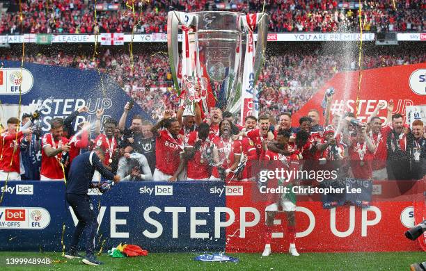 Lewis Grabban of Nottingham forest lifts the trophy following their team's victory in the Sky Bet Championship Play-Off Final match between...