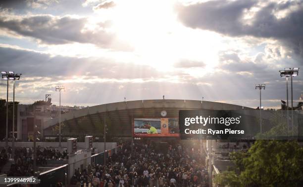 Crowds watch a TV screen as Rafael Nadal of Spain loses the fourth set against Felix Auger-Aliassime of Canada during the Men's Singles Fourth Round...