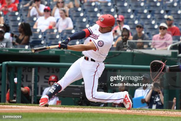 Juan Soto of the Washington Nationals hits a two run home run in the first inning during a baseball game against the Colorado Rockies at Nationals...