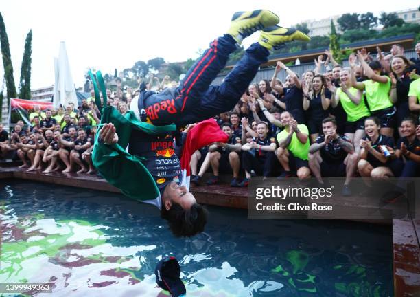 Race winner Sergio Perez of Mexico and Oracle Red Bull Racing celebrates with his team by jumping into the pool after the F1 Grand Prix of Monaco at...
