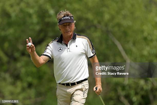 Bernhard Langer of Germany waves to the crowd on the first hole during the final round of the Senior PGA Championship presented by KitchenAid at...