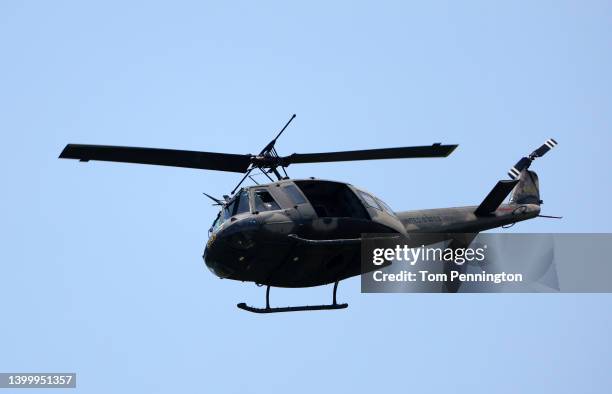 Bell UH-1 helicopter is seen during the Military Flyover commemorating Memorial Day during the final round of the Charles Schwab Challenge at...