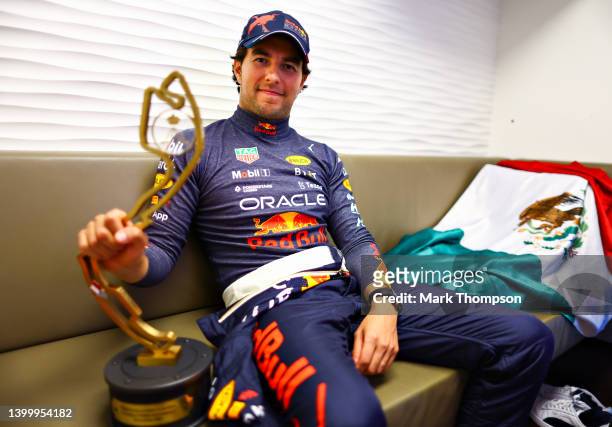 Race winner Sergio Perez of Mexico and Oracle Red Bull Racing relaxes with his trophy after the F1 Grand Prix of Monaco at Circuit de Monaco on May...