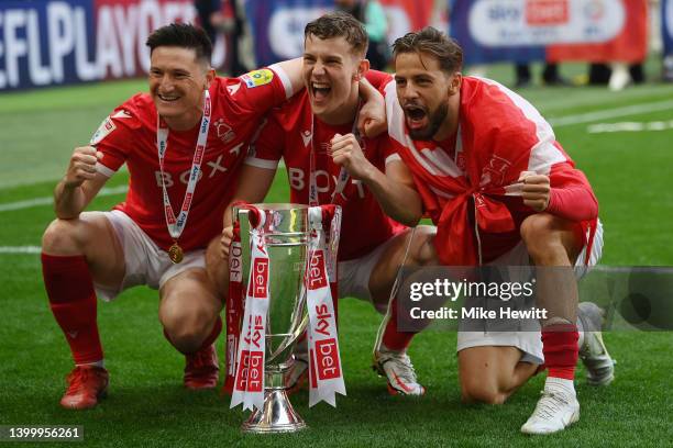 Joe Lolley, Ryan Yates and Philip Zinckernagel of Nottingham Forest celebrate with the trophy following their sides victory in the Sky Bet...