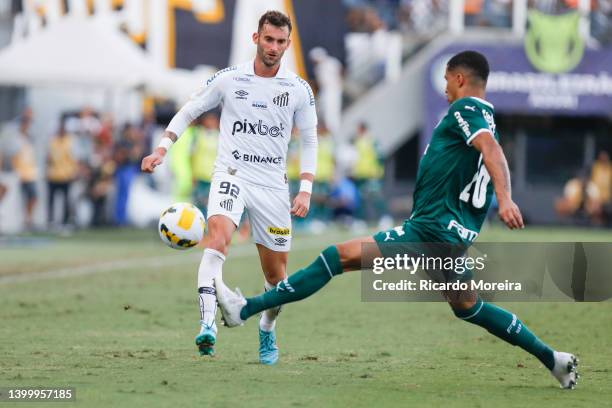 Léo Baptistão of Santos competes for the ball with Murilo of Palmeiras during the match between Santos and Palmeiras as part of Brasileirao Series A...