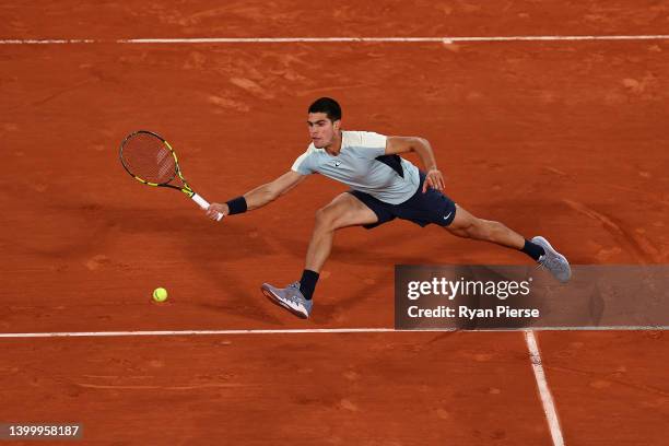 Carlos Alcaraz of Spain plays a forehand against Karen Khachanov during the Men's Singles Fourth Round match on Day 8 of The 2022 French Open at...