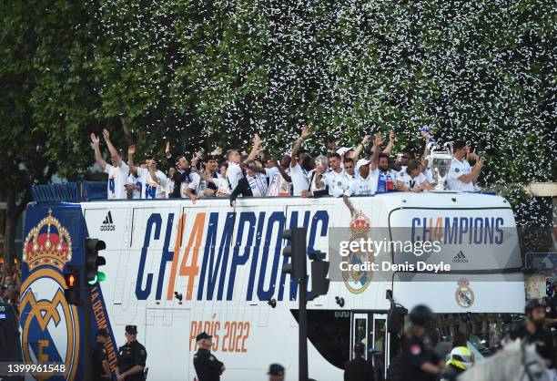 Real Madrid players celebrate on an open-top bus after winning the UEFA Champions League Final on May 29, 2022 in Madrid, Spain.