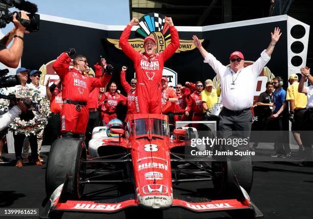 Marcus Ericsson of Sweden, driver of the Chip Ganassi Racing Honda, celebrates as he gets out of his car in Victory Lane after winning the 106th...