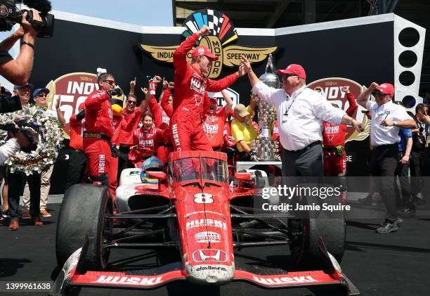 Marcus Ericsson of Sweden, driver of the Chip Ganassi Racing Honda, celebrates with team owner Chip Ganassi in Victory Lane after winning the 106th...