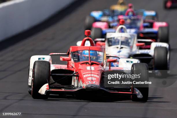 Marcus Ericsson, driver of the Huski Chocolate Chip Ganassi Racing Honda, leads a pack of cars during the 106th running of the Indianapolis 500 at...