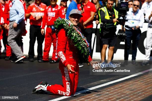 Marcus Ericsson of Sweden, driver of the Chip Ganassi Racing Honda, kneels to kiss the bricks after winning the 106th Running of The Indianapolis 500...