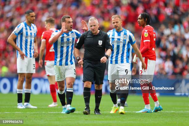 Harry Toffolo of Huddersfield Town argues with referee Jon Moss during the Sky Bet Championship Play-Off Final match between Huddersfield Town and...