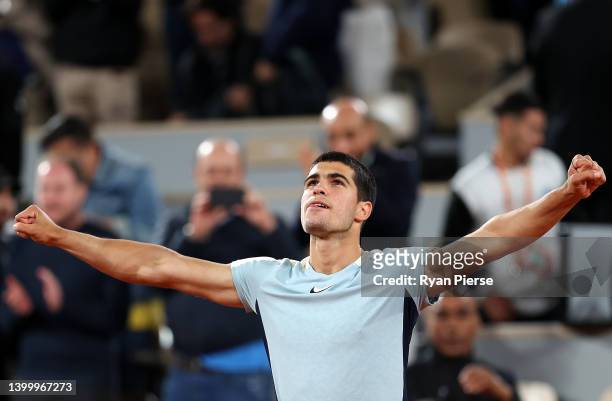 Carlos Alcaraz of Spain celebrates match point against Karen Khachanov during the Men's Singles Fourth Round match on Day 8 of The 2022 French Open...