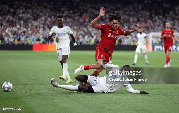 Trent Alexander-Arnold of Liverpool is challenged by Ferland Mendy of Real Madrid during the UEFA Champions League final match between Liverpool FC...