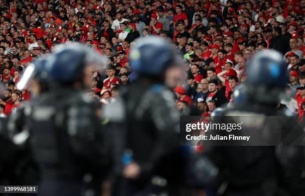 Police watch over the Liverpool fans during the UEFA Champions League final match between Liverpool FC and Real Madrid at Stade de France on May 28,...