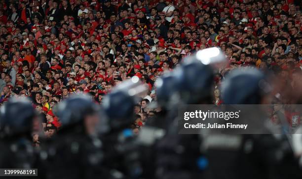 Police watch over the Liverpool fans during the UEFA Champions League final match between Liverpool FC and Real Madrid at Stade de France on May 28,...