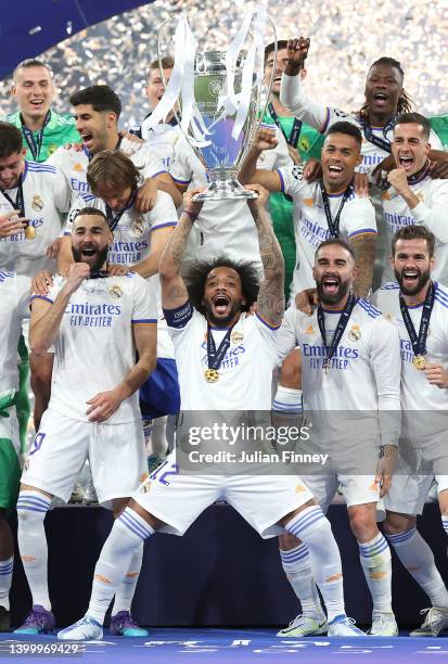 Marcelo of Real Madrid lifts the UEFA Champions League trophy after their sides victory during the UEFA Champions League final match between...