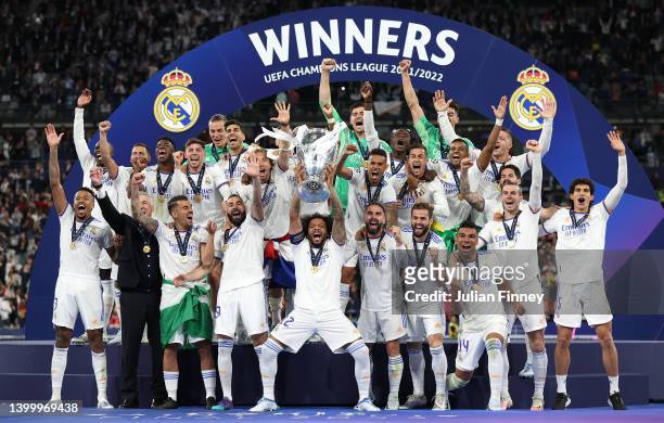 Marcelo of Real Madrid lifts the UEFA Champions League trophy after their sides victory during the UEFA Champions League final match between...