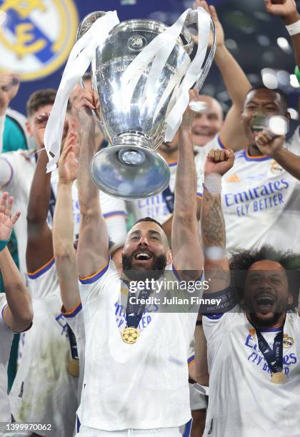 Karim Benzema of Real Madrid lifts the UEFA Champions League trophy after their sides victory during the UEFA Champions League final match between...