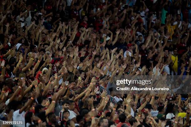 Fans of Flamengo cheer on their team during the match between Fluminense and Flamengo as part of Brasileirao Series A 2022 at Maracana Stadium on May...