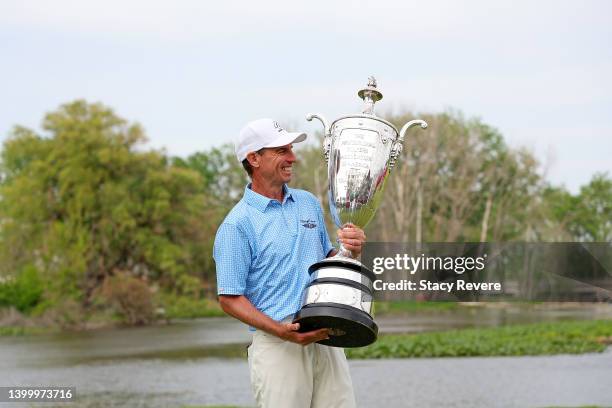 Steven Alker of New Zealand poses with the Alfred S. Bourne trophy after winning the Senior PGA Championship presented by KitchenAid at Harbor Shores...