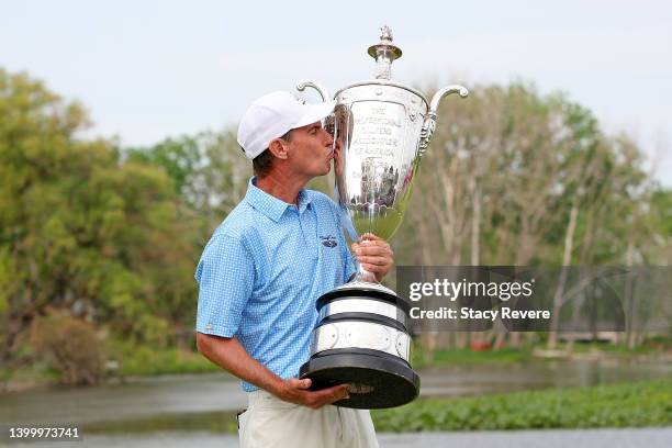 Steven Alker of New Zealand poses with the Alfred S. Bourne trophy after winning the Senior PGA Championship presented by KitchenAid at Harbor Shores...