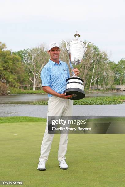 Steven Alker of New Zealand poses with the Alfred S. Bourne trophy after winning the Senior PGA Championship presented by KitchenAid at Harbor Shores...