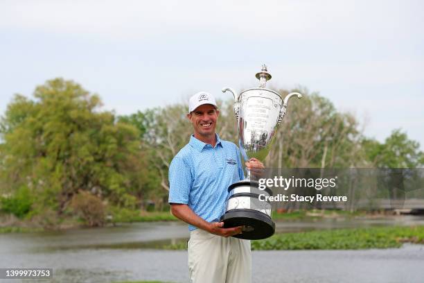 Steven Alker of New Zealand poses with the Alfred S. Bourne trophy after winning the Senior PGA Championship presented by KitchenAid at Harbor Shores...