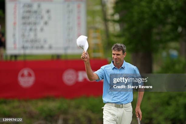 Steven Alker of New Zealand waves to the crowd following the final round of the Senior PGA Championship presented by KitchenAid at Harbor Shores...