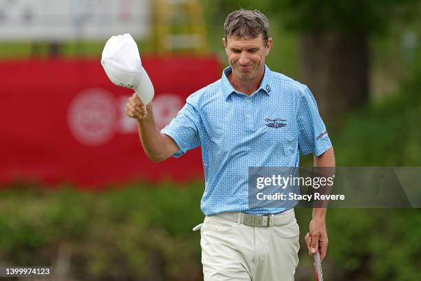 Steven Alker of New Zealand waves to the crowd following the final round of the Senior PGA Championship presented by KitchenAid at Harbor Shores...