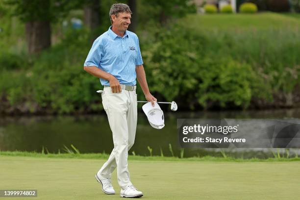 Steven Alker of New Zealand walks across the 18th green during the final round of the Senior PGA Championship presented by KitchenAid at Harbor...