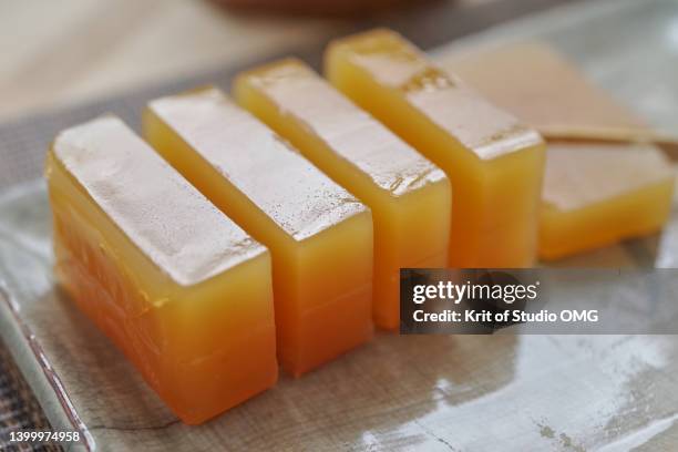 close-up view of the sweet potato yokan on the ceramic plate - 羊羹 ストックフォトと画像