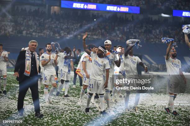 Real Madrid manager Carlo Ancelotti walks with his team during celebrations at estadio Santiago Bernabeu after winning the UEFA Champions League...