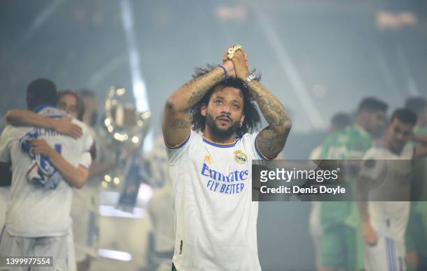 Marcelo of Real Madrid acknowledges supporters during celebrations at estadio Santiago Bernabeu after winning the UEFA Champions League Final on May...
