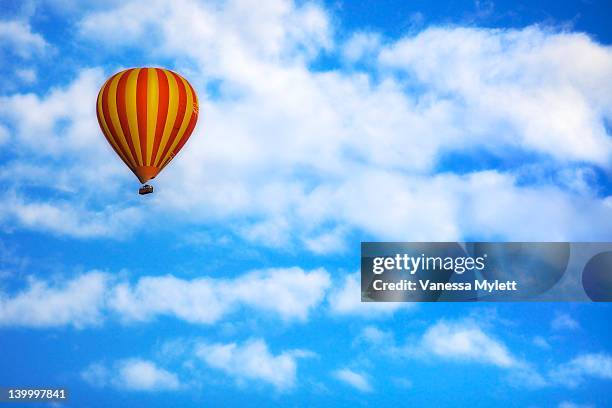 hot air balloon drifting in blue sky - hot air balloon australia stockfoto's en -beelden