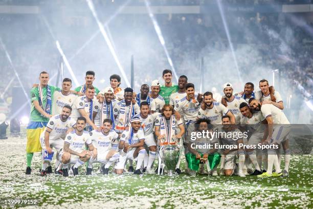 Players of Real Madrid pose for photo with the trophy during the celebration of Real Madrid as winners of the 14th UEFA Champions League against...