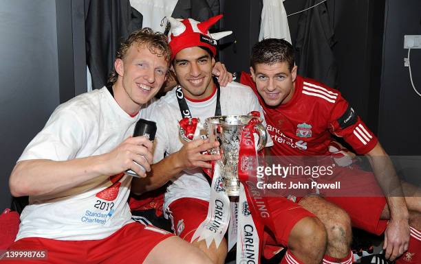 Dirk Kuyt, Luis Suarez and Steven Gerrard of Liverpool celebrate with the trophy at the end of the Carling Cup Final match between Liverpool and...