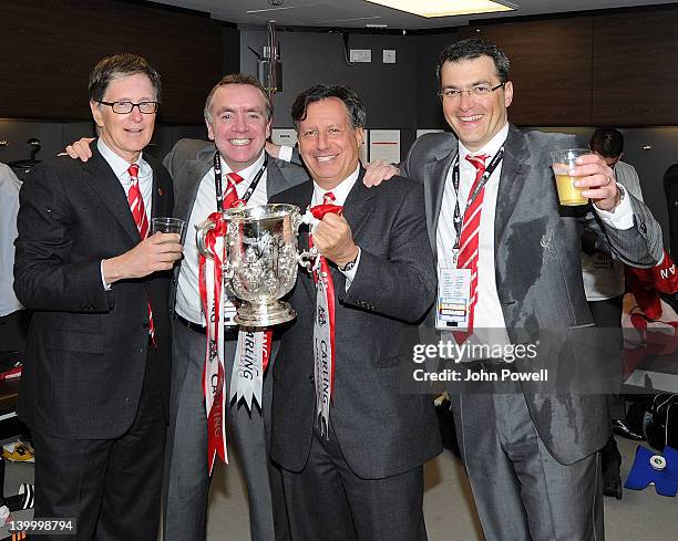 John W Henry, owner of Liverpool FC, Ian Ayre managing director, Tom Werner, owner and Damien Comolli, director of football at Liverpool FC celebrate...