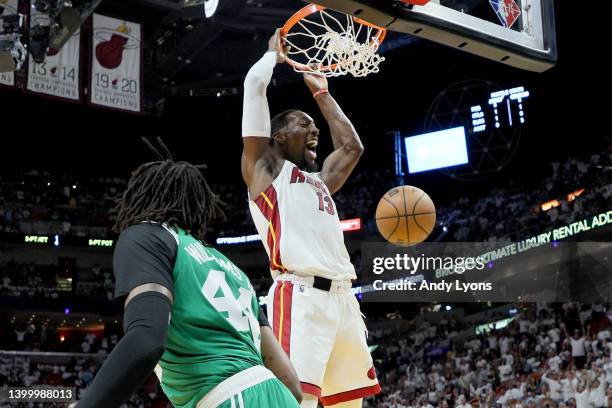 Bam Adebayo of the Miami Heat dunks the ball against Robert Williams III of the Boston Celtics during the first quarter in Game Seven of the 2022 NBA...