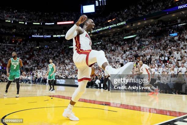 Bam Adebayo of the Miami Heat reacts after dunking the ball against Robert Williams III of the Boston Celtics during the first quarter in Game Seven...