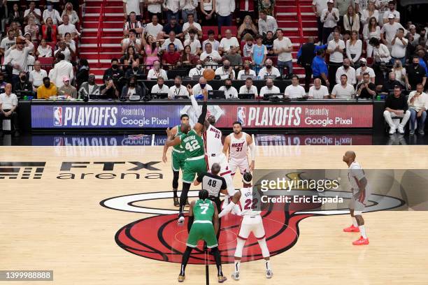 Bam Adebayo of the Miami Heat jumps for the ball against Al Horford of the Boston Celtics to start the first quarter in Game Seven of the 2022 NBA...