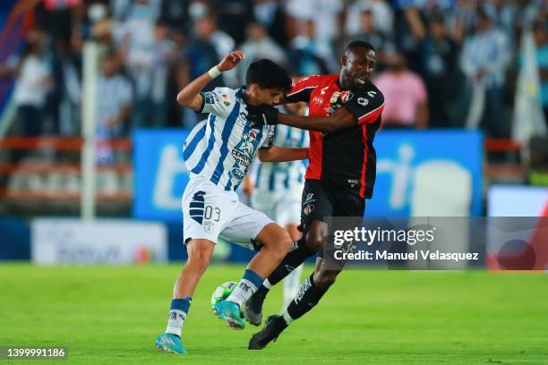 Kevin Alvarez of Pachuca fights for the ball with Julián Quiñones of Atlas during the final second leg match between Pachuca and Atlas as part of the...