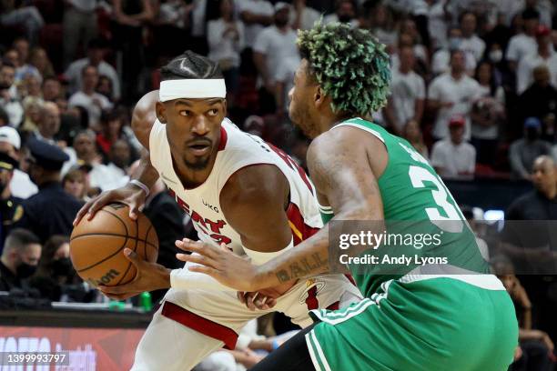 Jimmy Butler of the Miami Heat is defended by Marcus Smart of the Boston Celtics during the first quarter in Game Seven of the 2022 NBA Playoffs...