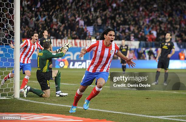 Falcao of Atletico Madrid celebrates after scoring his team's opening goal during the La Liga match between Atletico Madrid and Barcelona at Vicente...