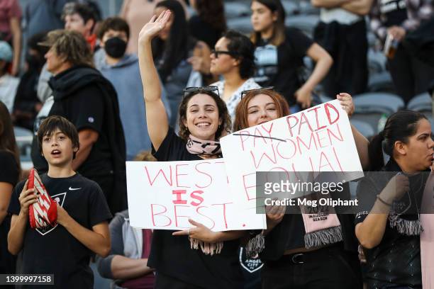 Angel City FC fans hold up signs after the game against the NJ/NY Gotham FC at Banc of California Stadium on May 29, 2022 in Los Angeles, California.