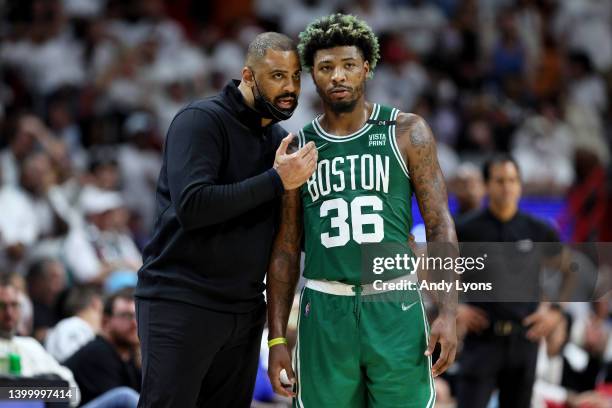 Head Coach Ime Udoka of the Boston Celtics talks with Marcus Smart against the Miami Heat during the third quarter in Game Seven of the 2022 NBA...