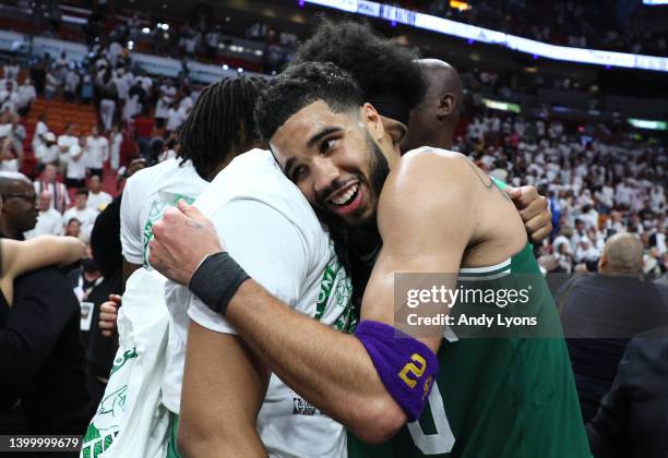 Jayson Tatum of the Boston Celtics celebrates with his teammates after defeating the Miami Heat with a score of 100 to 96 in Game Seven of the 2022...