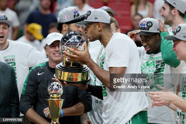 Al Horford of the Boston Celtics kisses the Eastern Conference Bob Cousy champions trophy after defeating the Miami Heat in Game Seven to win the...