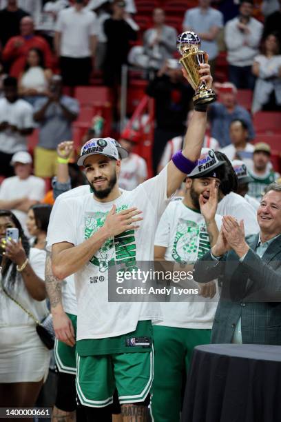 Jayson Tatum of the Boston Celtics celebrates after being awarded the Eastern Conference Larry Bird MVP trophy after defeating the Miami Heat in Game...